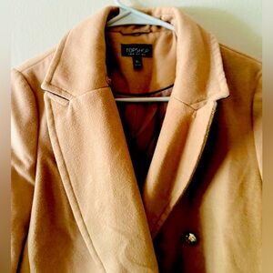 Classic Camel Coat

Elevate your wardrobe with our timeless camel coat.